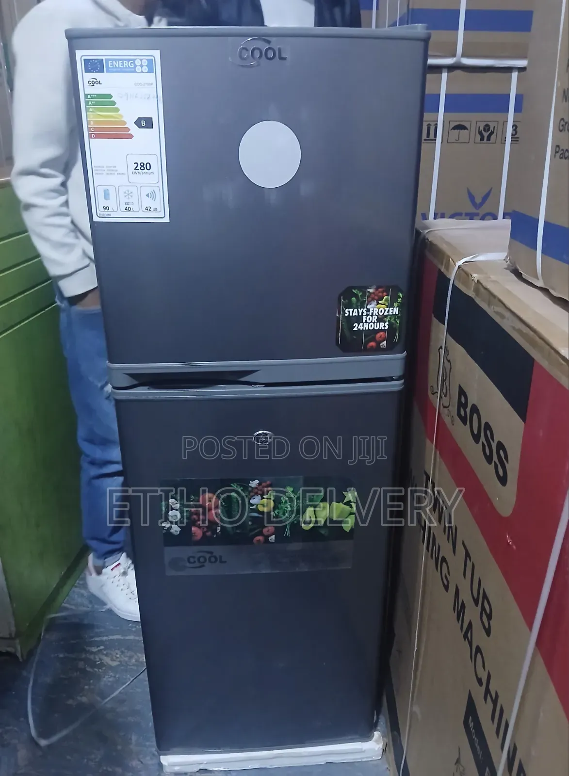 This Is a Cool Brand Top-Mount Double-Door Refrigerator in a Dark Grey