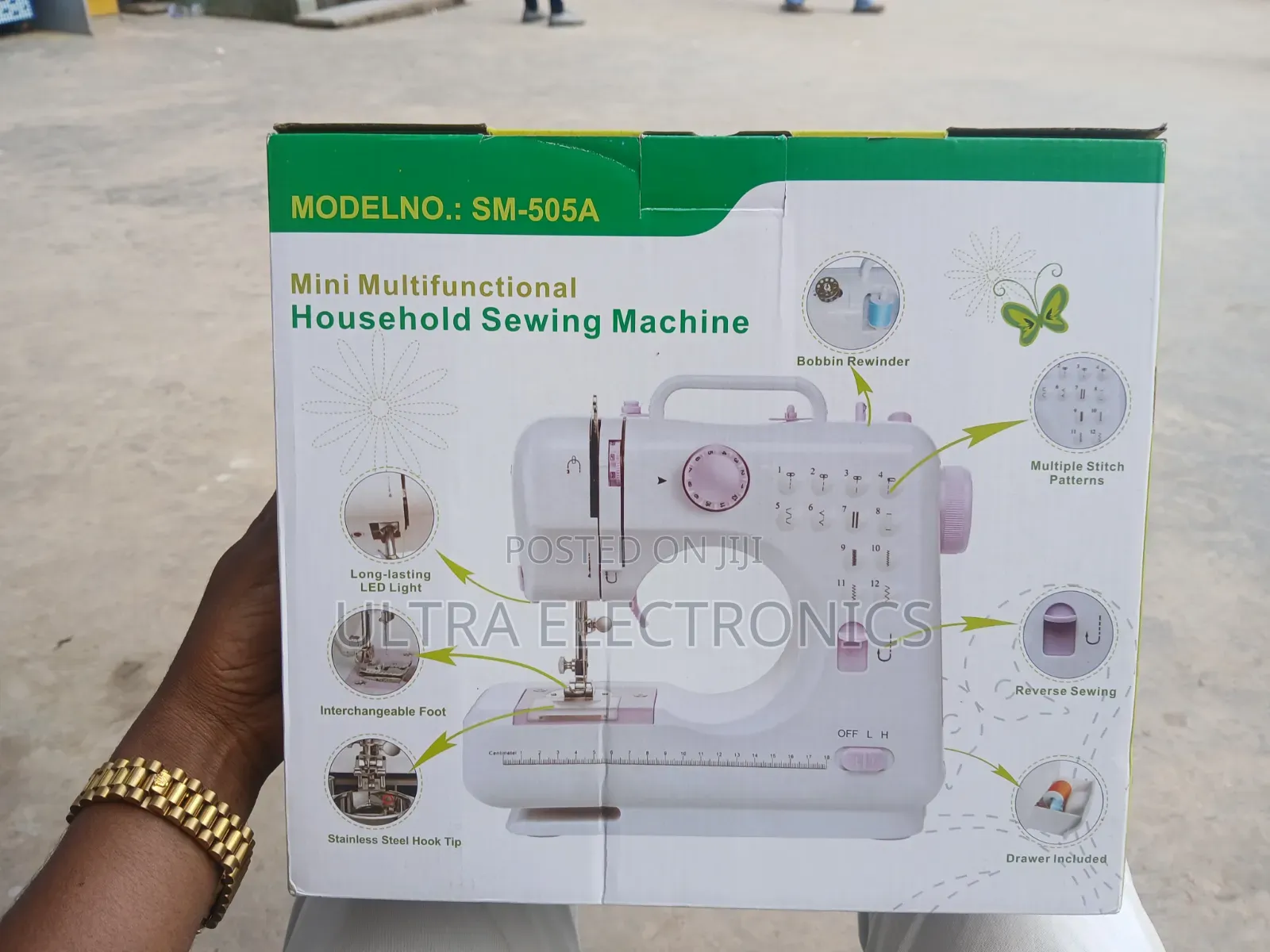 Mini Multifunctional Household Sewing Machine in Its Product Box.
