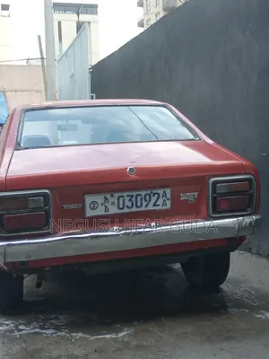 Nissan 100 1975 Burgundy