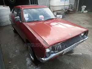 Nissan 100 1975 Burgundy