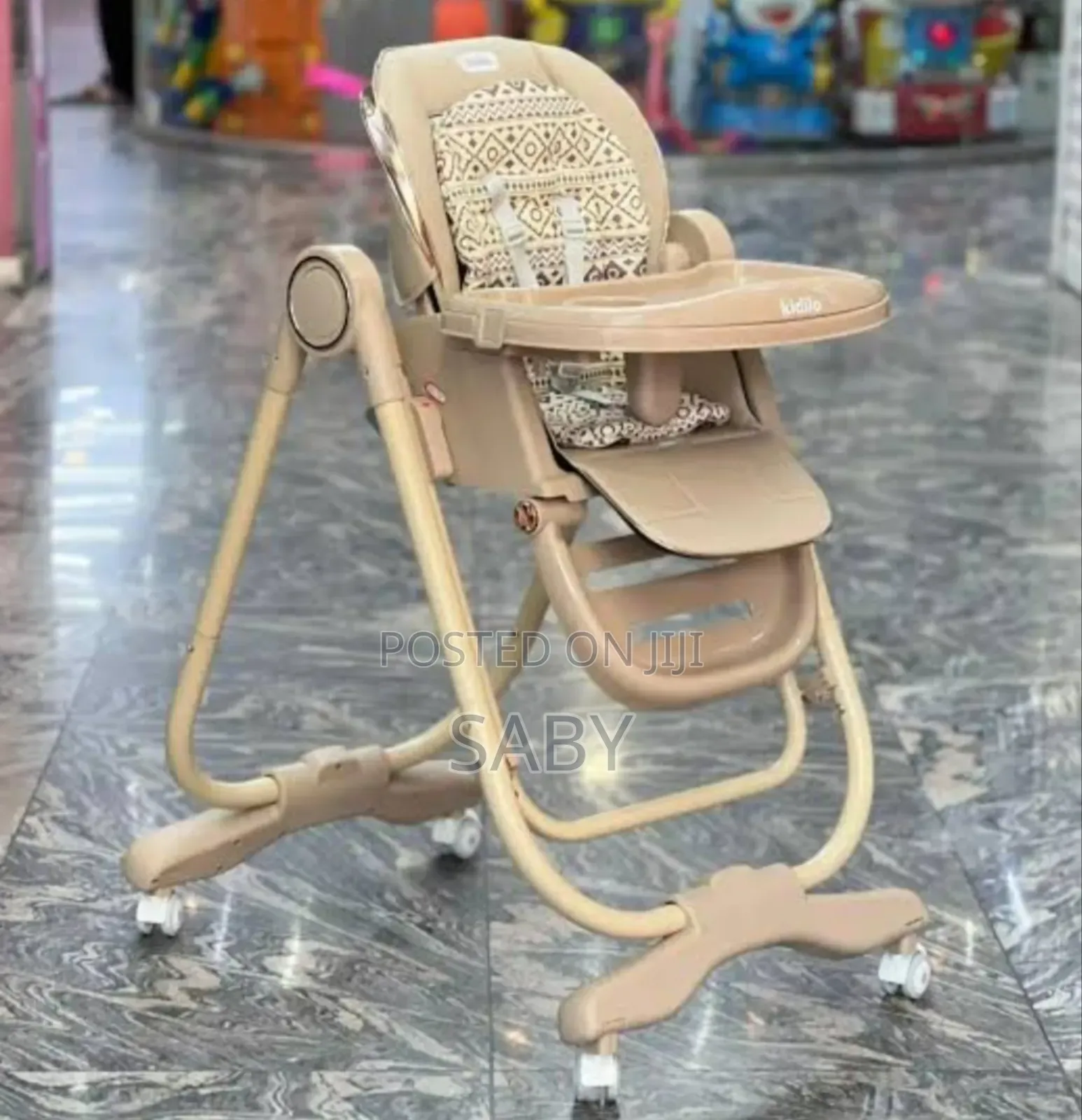 Multifunctional High Chair Features a Beige, Patterned Seat