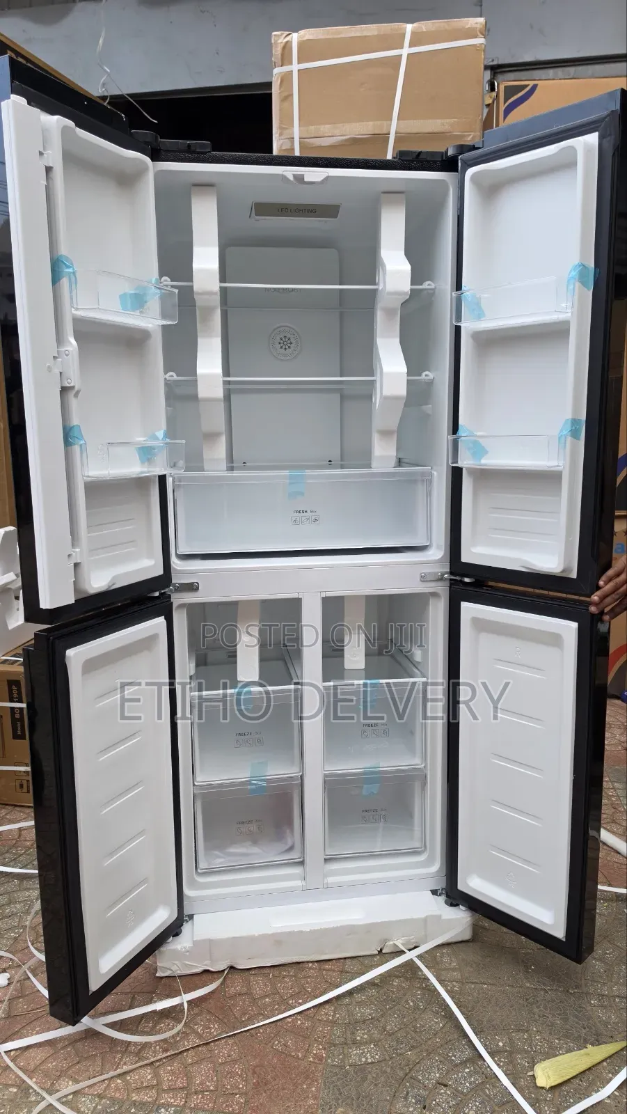 This Refrigerator Is a Black Four-Door French Door Model With