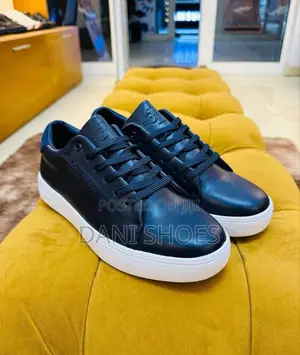 Calvin Klein Low-Top Leather Sneakers.