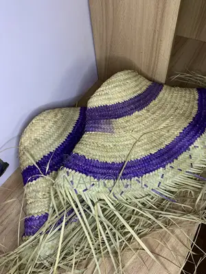 HAT Woven Paper Straw Wide-Brim Hat Features a Distinctive Silver Star