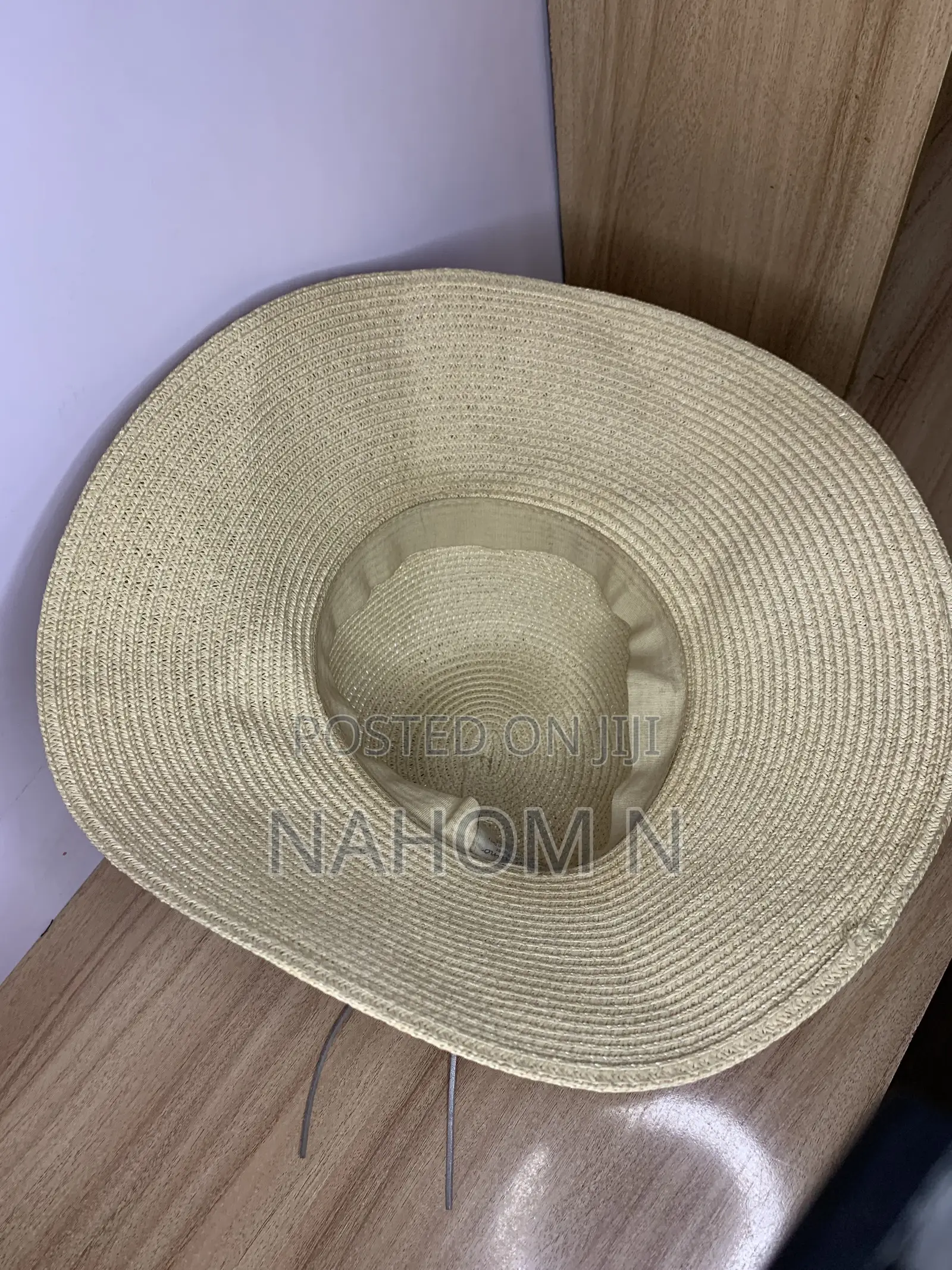 HAT Woven Paper Straw Wide-Brim Hat Features a Distinctive Silver Star