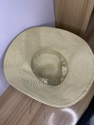 HAT Woven Paper Straw Wide-Brim Hat Features a Distinctive Silver Star