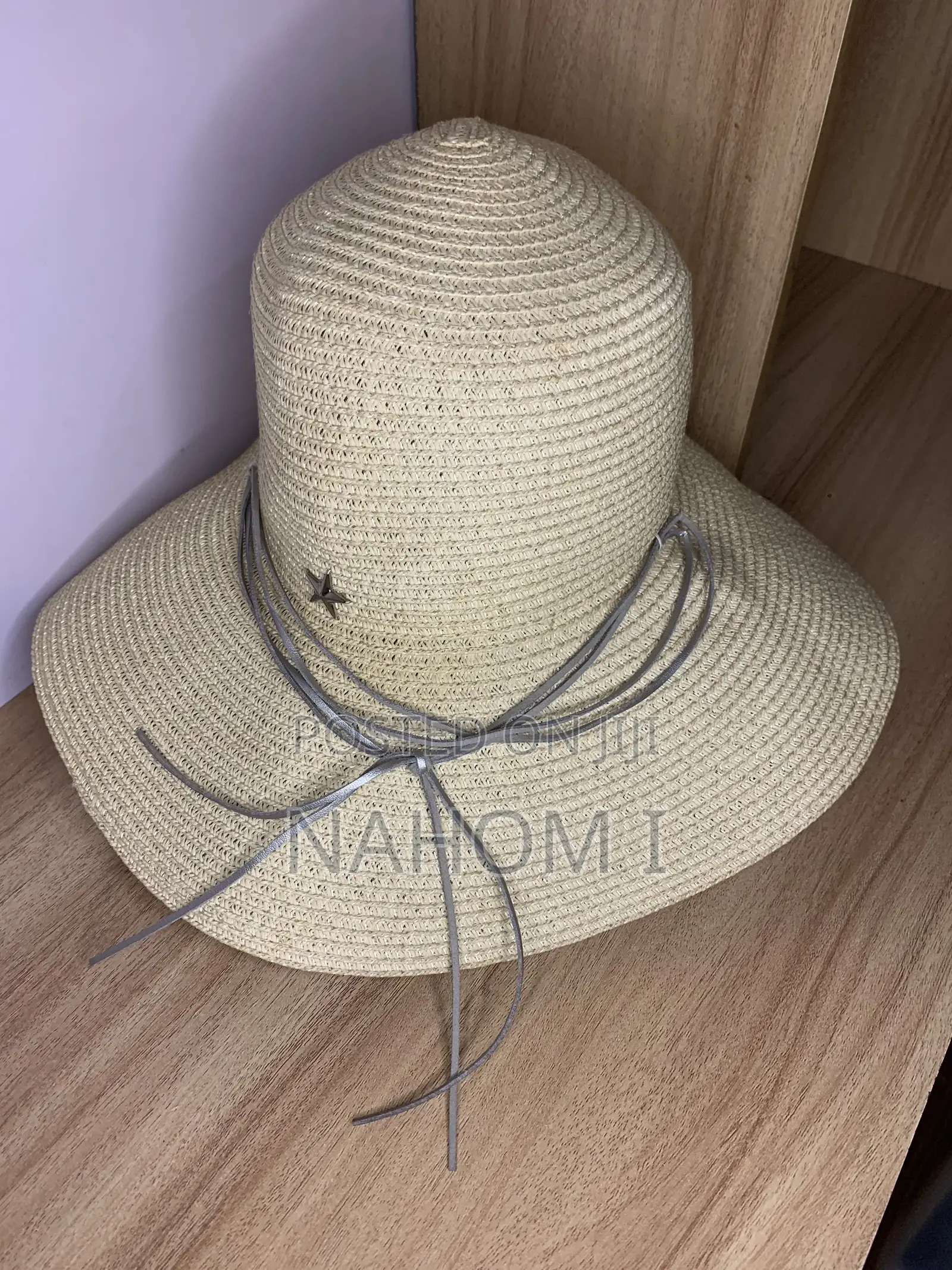 HAT Woven Paper Straw Wide-Brim Hat Features a Distinctive Silver Star