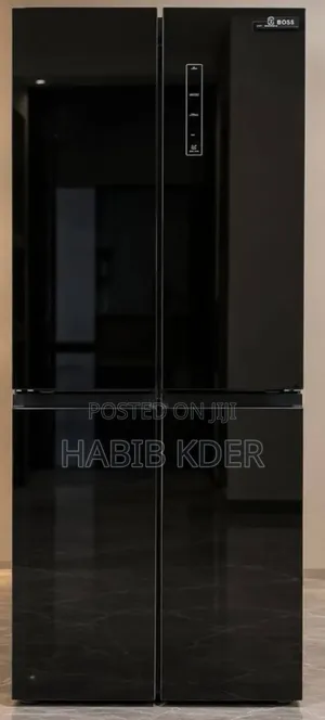 ￼ ￼ +4 This Is a Boss Brand 4-Door Refrigerator Featuring a Black