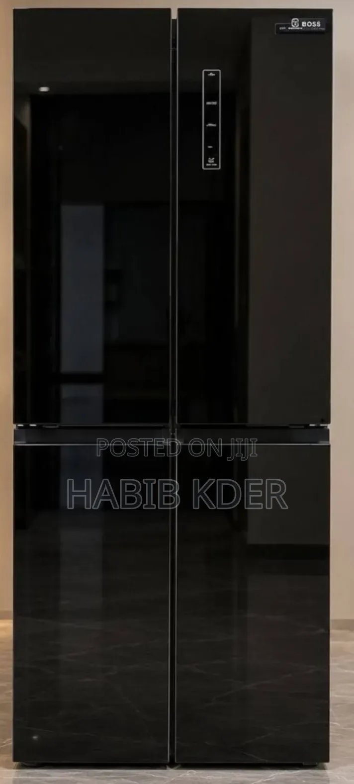 ￼ ￼ +4 This Is a Boss Brand 4-Door Refrigerator Featuring a Black