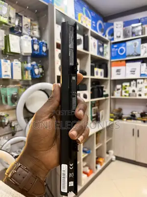 Person Holding a Slim Laptop Battery Replacement