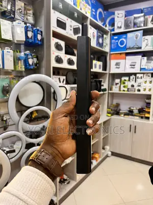 Person Holding a Slim Laptop Battery Replacement
