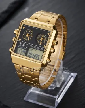 Watch Featuring a Prominent Gold-Toned Stainless Steel Band and Case.