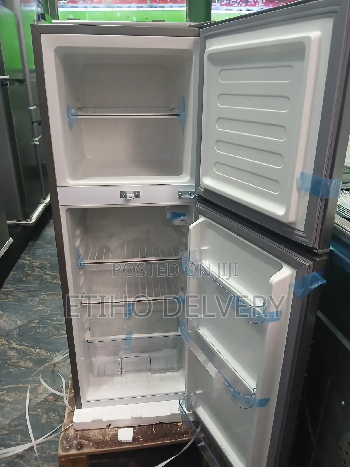 This Evergreen Branded, Top-Freezer Refrigerator Features a Sleek Sil