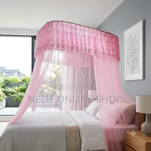 Luxurious Canopy Bed Setup With a Purple Mosquito Net Ensemble: