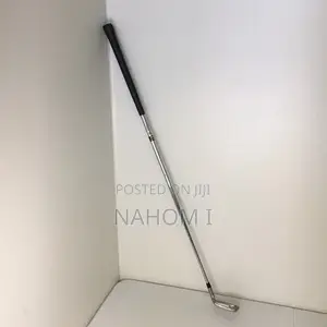 Golf Club, Potentially a 9-Iron or a Pitching Wedge.