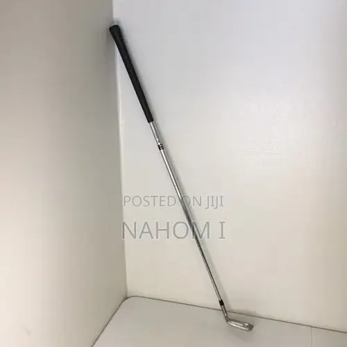 Golf Club, Potentially a 9-Iron or a Pitching Wedge.