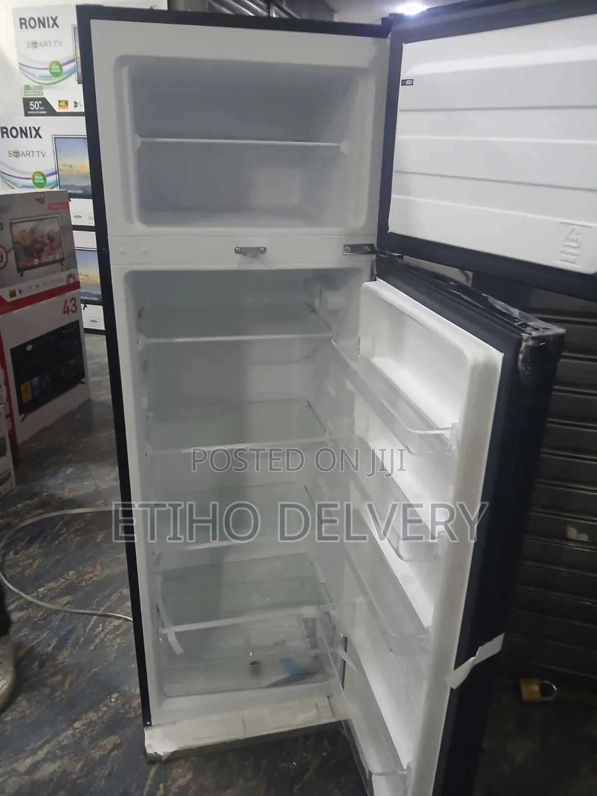 This Black Midea Refrigerator Features a Top-Mounted Freezer and a Hig