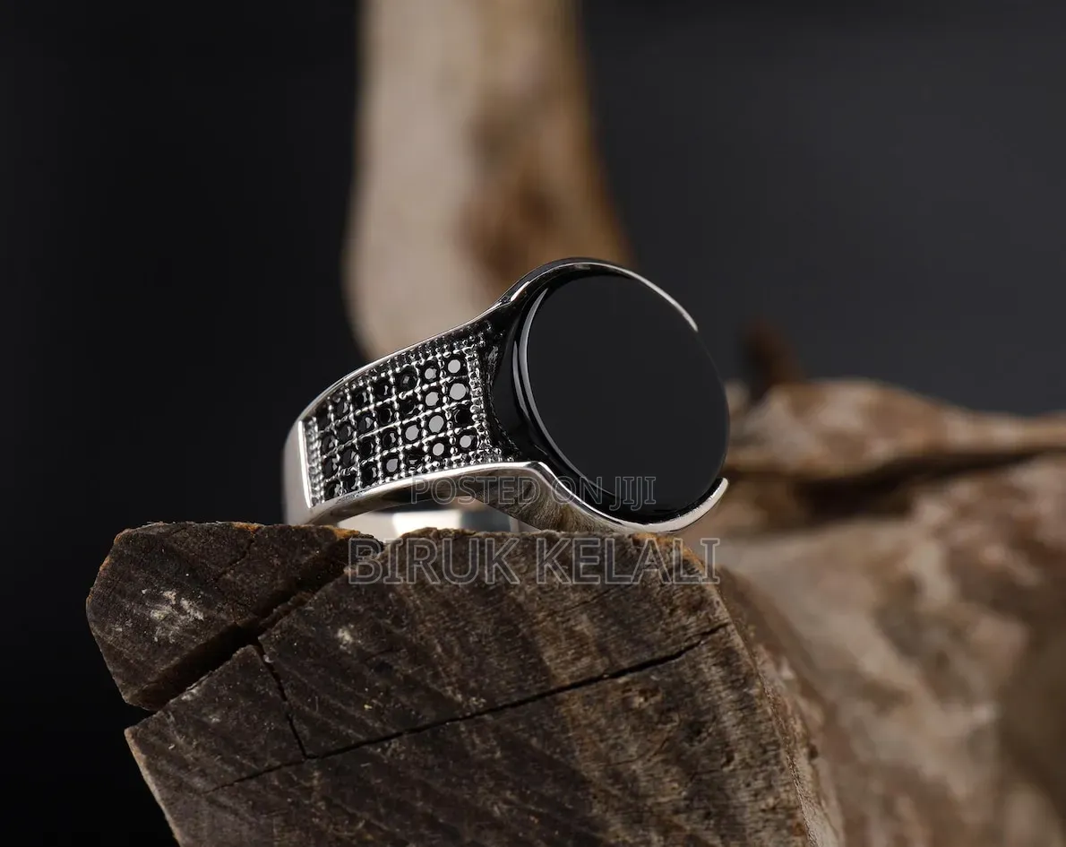Sterling Silver Ring Featuring a Black Onyx Stone and Smaller Black
