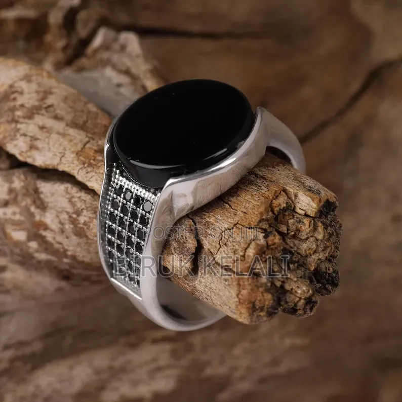 Sterling Silver Ring Featuring a Black Onyx Stone and Smaller Black