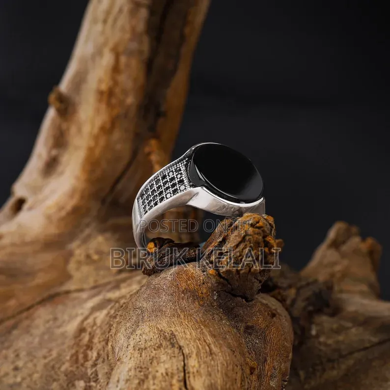 Sterling Silver Ring Featuring a Black Onyx Stone and Smaller Black