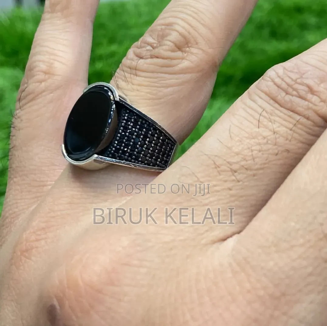 Sterling Silver Ring Featuring a Black Onyx Stone and Smaller Black
