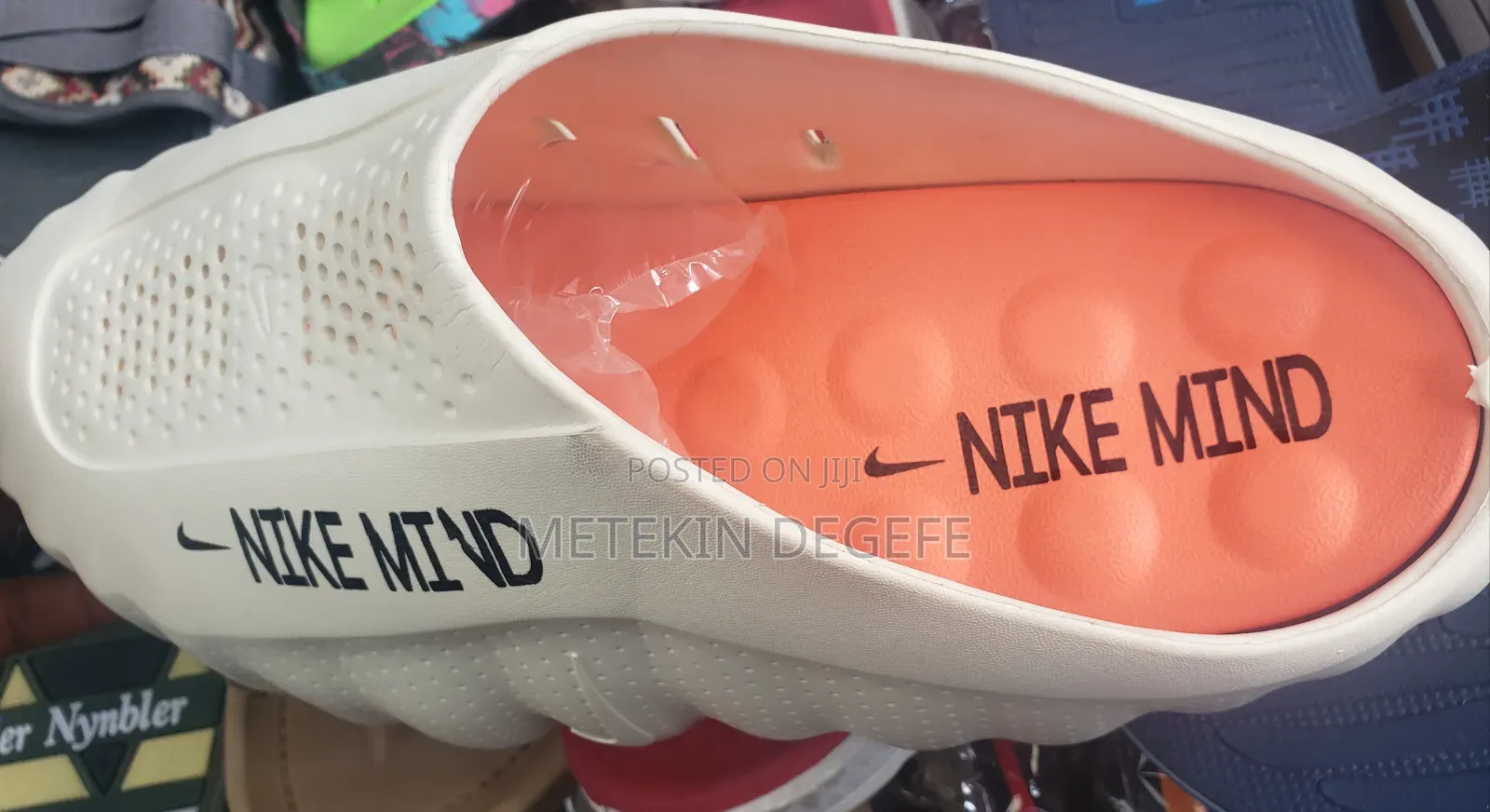 Nike Mind 001 Slip-on Mules in a White and Orange Colorway