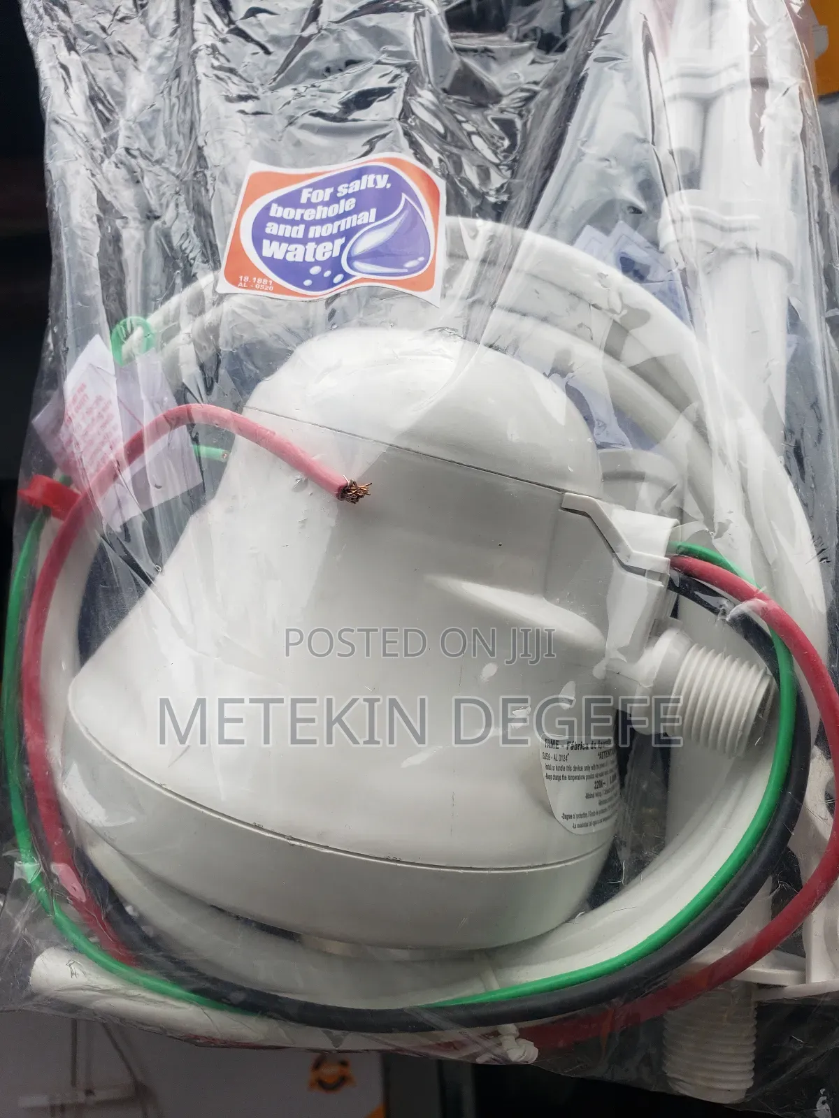 Electric Shower Head Packaged in Plastic.