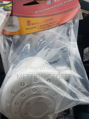 Electric Shower Head Packaged in Plastic.