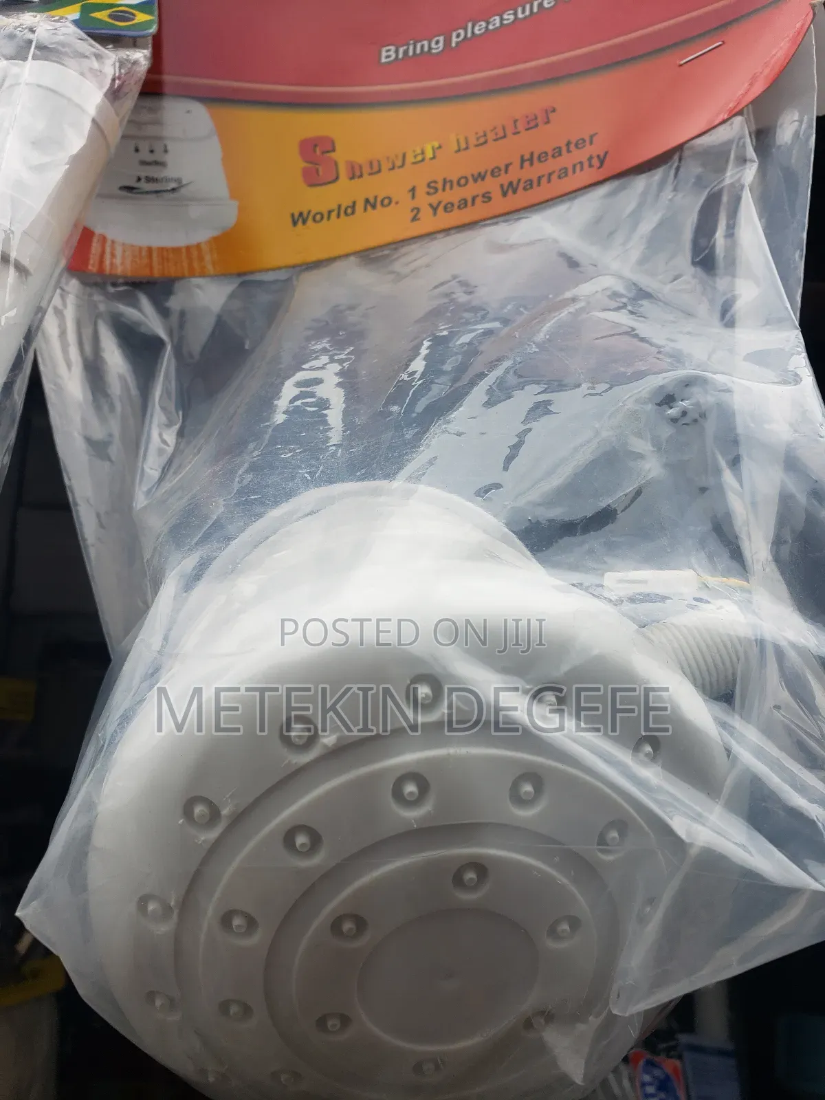 Electric Shower Head Packaged in Plastic.
