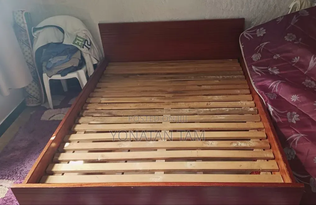 Bed Along With It's Matress and a Night Stand