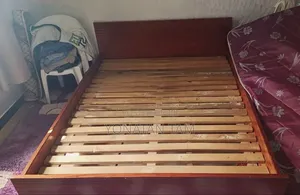 Bed Along With It's Matress and a Night Stand