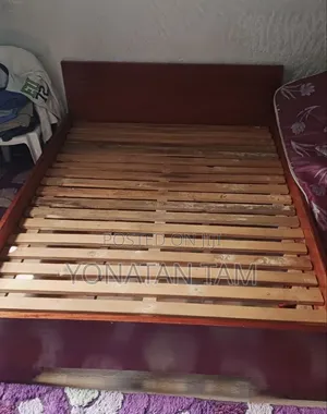 Bed Along With It's Matress and a Night Stand