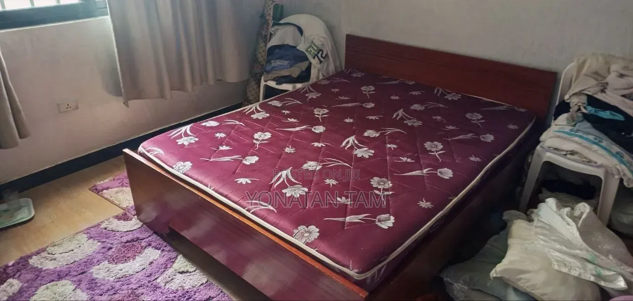 Bed Along With It's Matress and a Night Stand