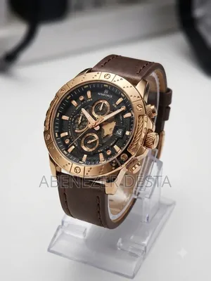 Naviforce Watch Featuring a Rose Gold Case and a Brown Leather