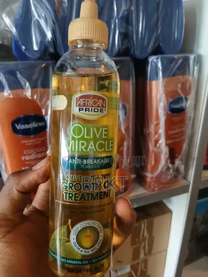 የአፍሪካን ፕራይድ የፀጉር ማሳደጊያ ዘይት (African Pride Olive Tea Tree Growth Oil)