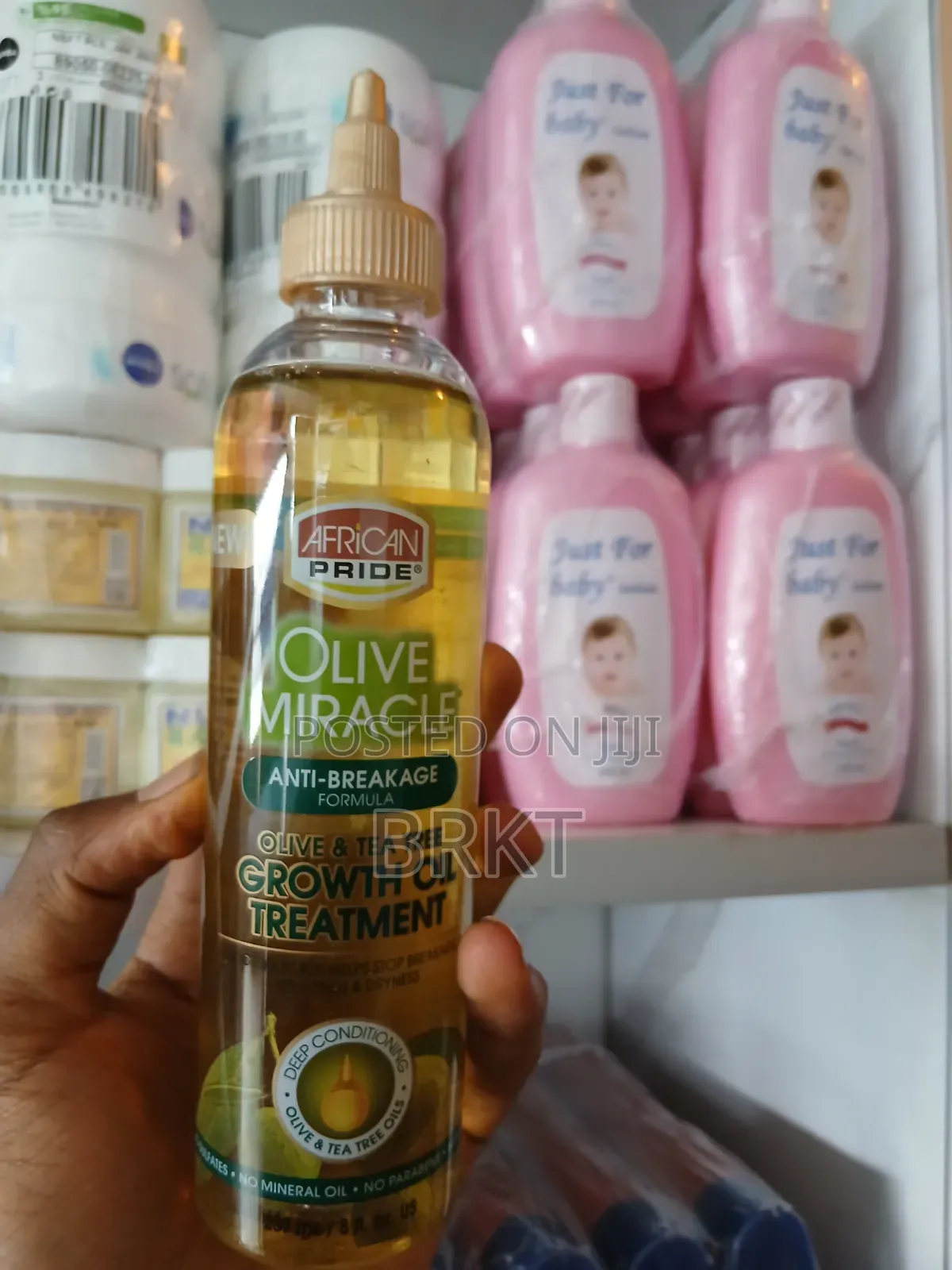 የአፍሪካን ፕራይድ የፀጉር ማሳደጊያ ዘይት (African Pride Olive Tea Tree Growth Oil)