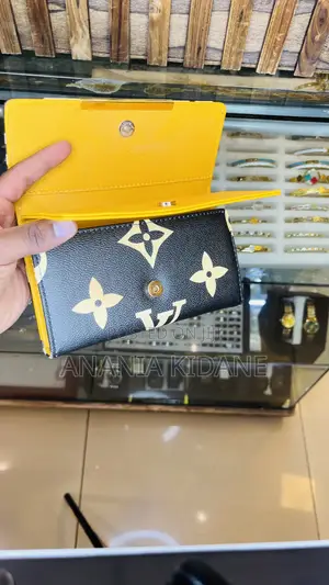 The Double Leather Wallet LV