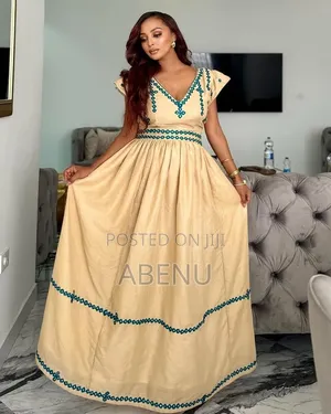 Elegant Cream Ethiopian Habesha Kemis With Teal Embroidery