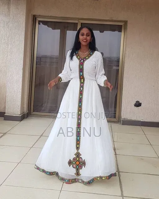 Elegant Cream Ethiopian Habesha Kemis With Teal Embroidery