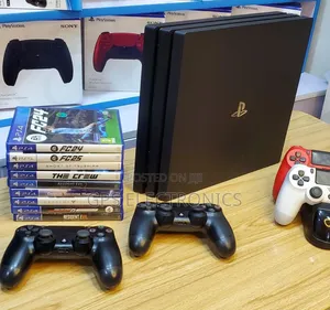 PS4 PRO | Dubai Imported —• 2 Original Joystick • FC 26 + 5 Games •