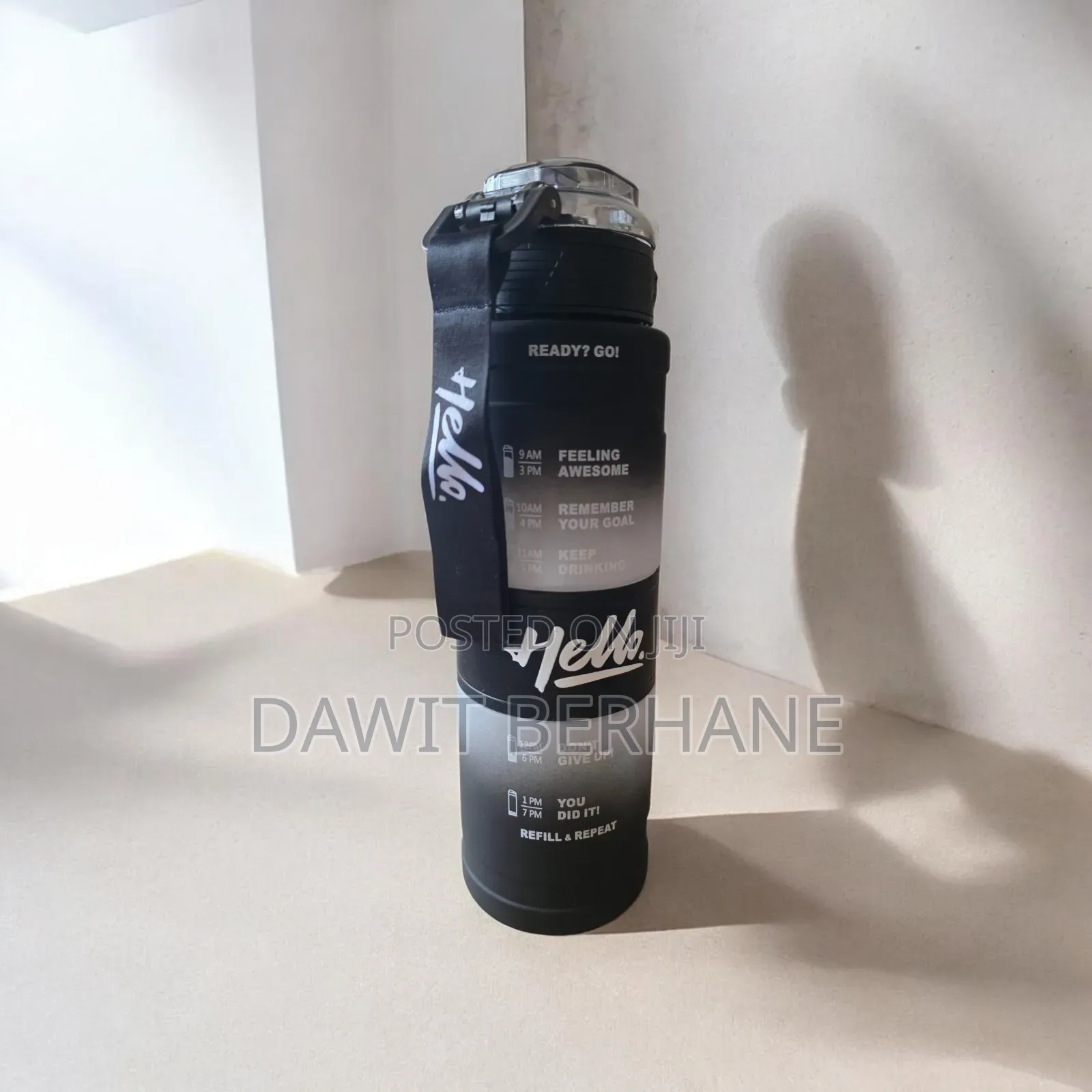 1-Liter "Hello" Motivational Water Bottle With a Time Marker.