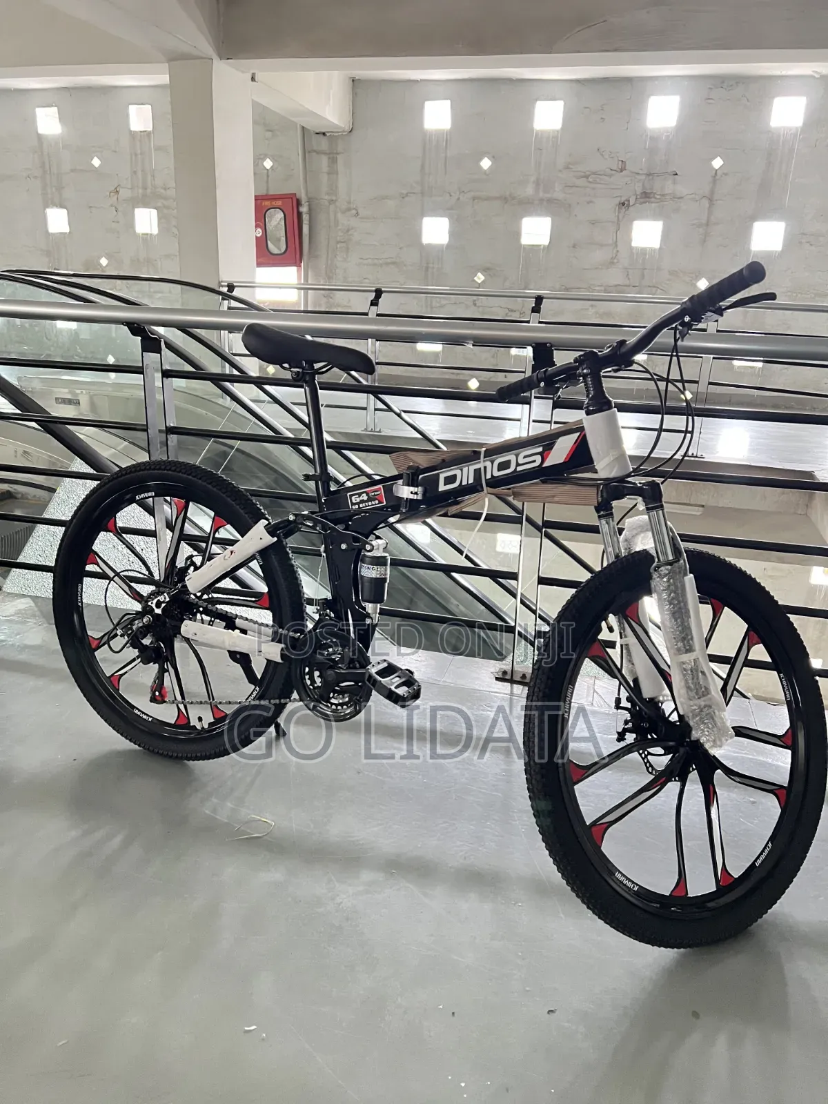 አማርኛ: DINOS ለተራራ እና ገጠር ጉዞ — English: DINOS Mountain Off-Road Bike