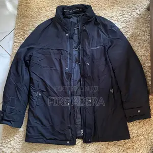 Men's Mid-Length Winter Parka Jacket With a Detachable Hood.