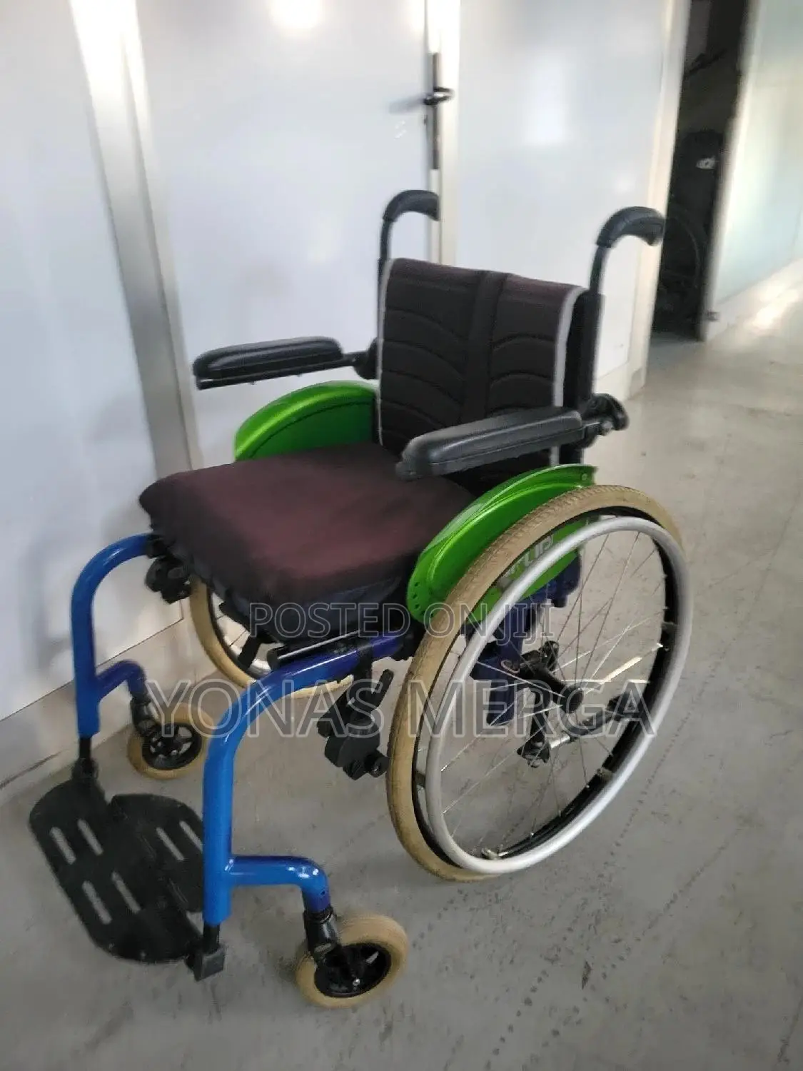 Wheelchair彆wheelchair, Characterized by Its Bright Blue Rigid Frame