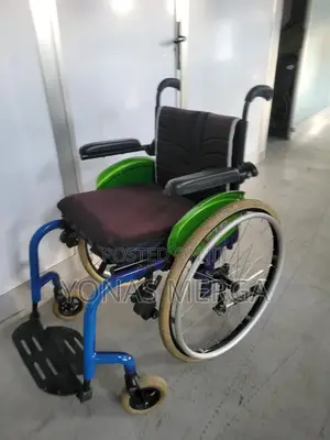 Wheelchair彆wheelchair, Characterized by Its Bright Blue Rigid Frame