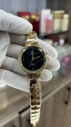 Calvin Klein Gold Women's Quartz Watch - Faceted Glass Black Dial