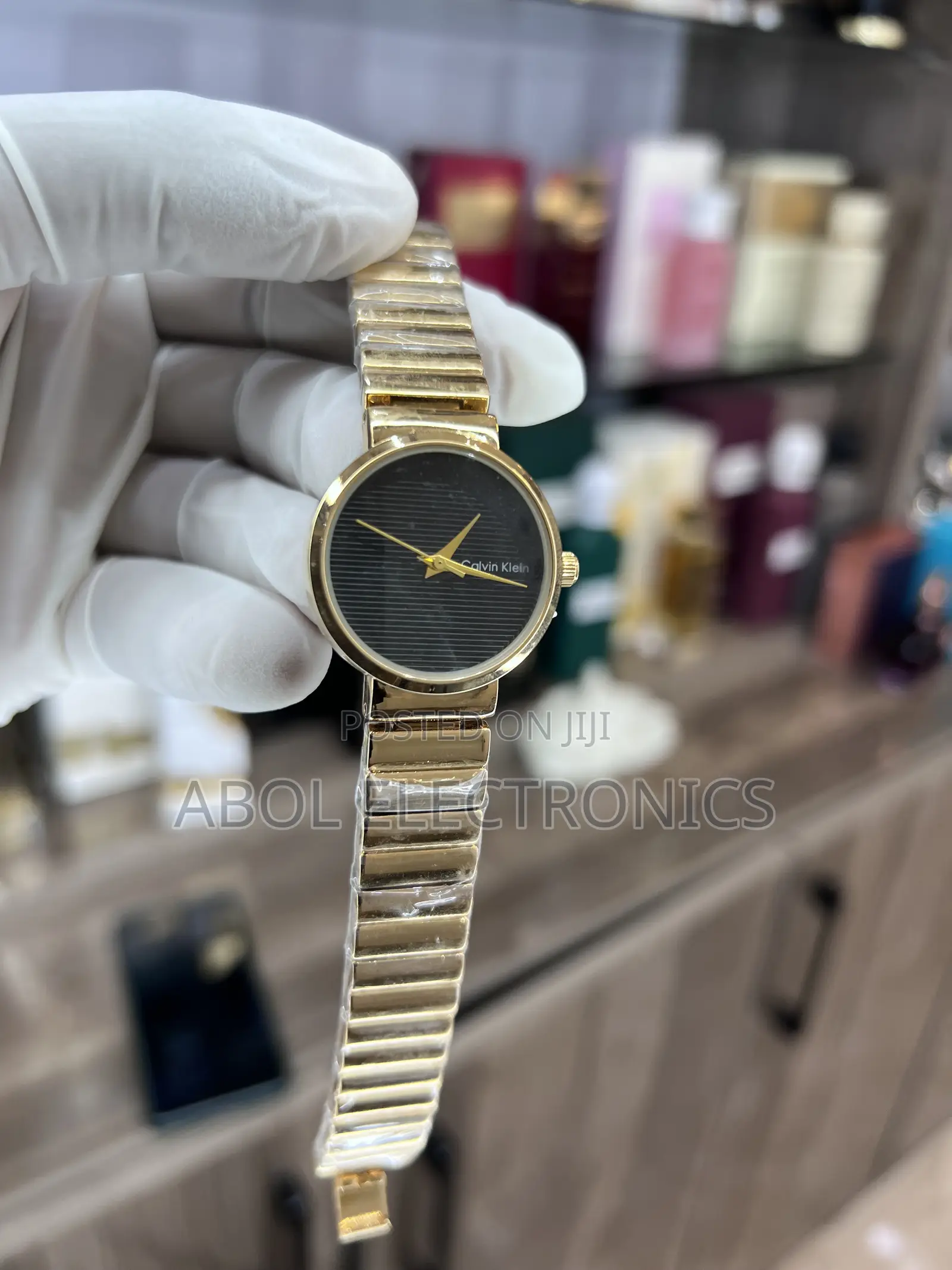 Calvin Klein Gold Women's Quartz Watch - Black Striped Dial Segment