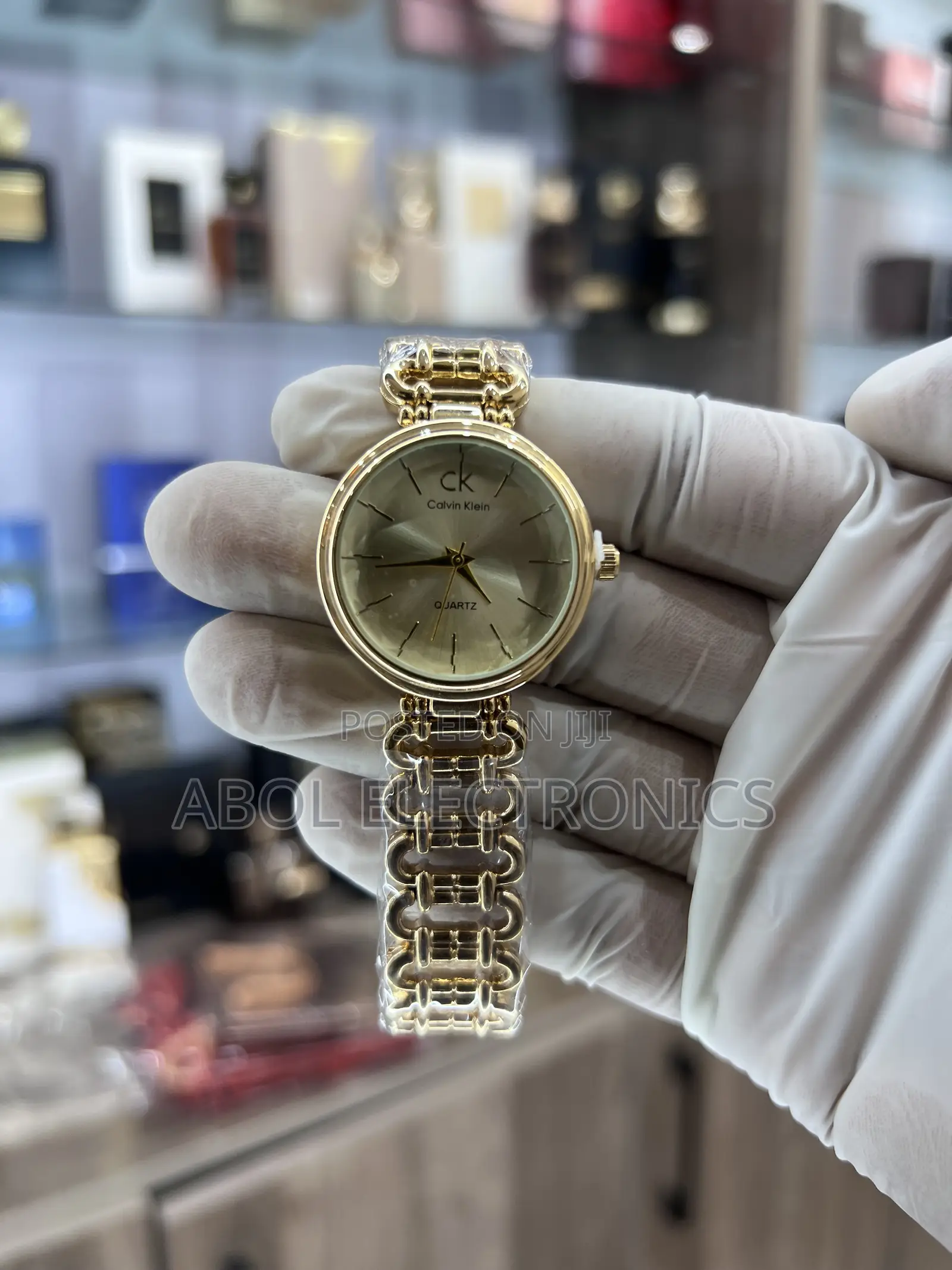 Calvin Klein All-Gold Women's Quartz Watch - Sunburst Dial Chain