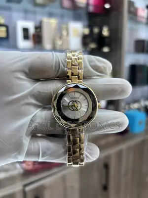 Gucci Gold Women's Quartz Watch - Faceted Glass Silver Monogram Dial
