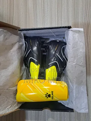 KELME Football Cleats + Shin Guards